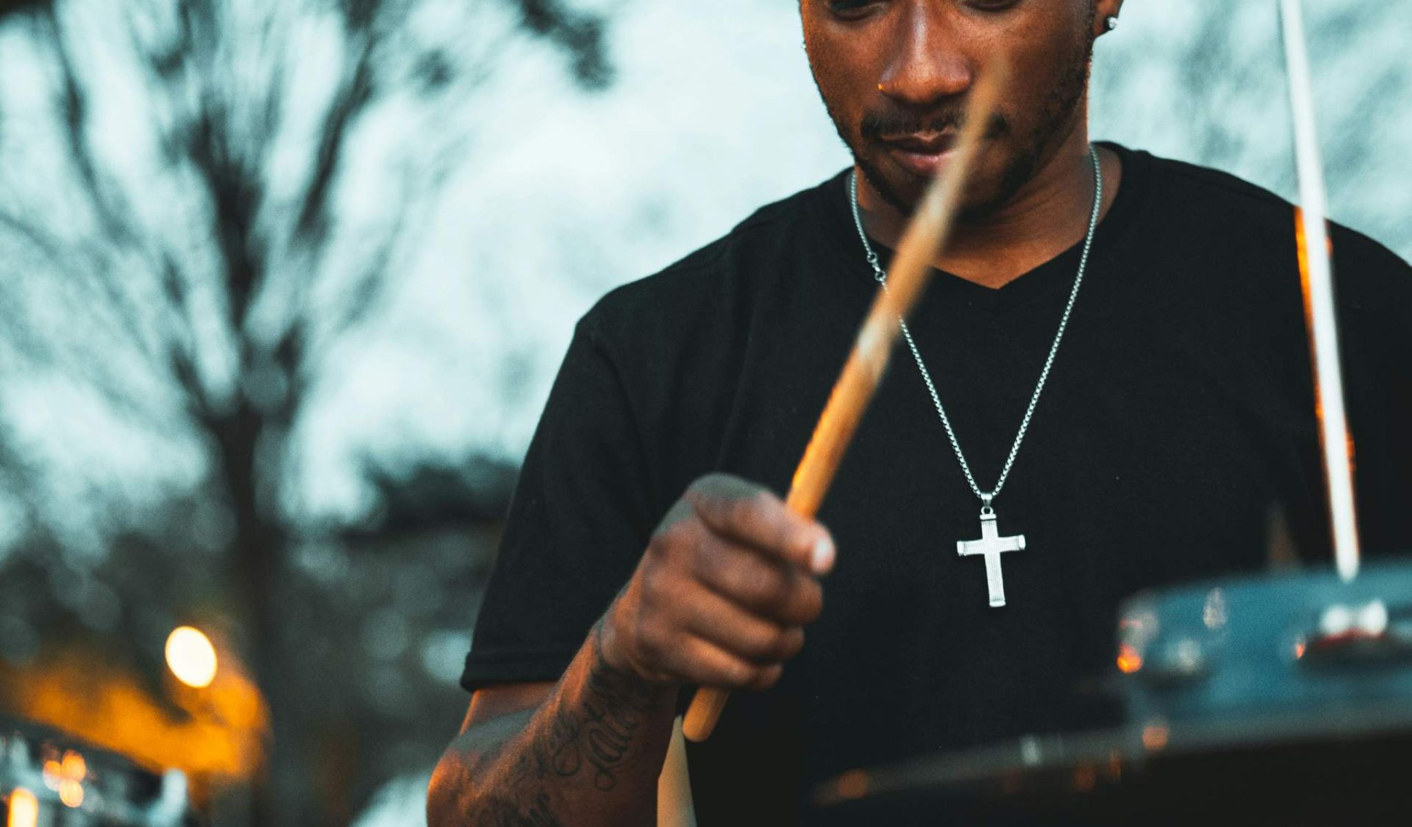 man playing electronic drum set while at a local attraction near chapel hill north apartments