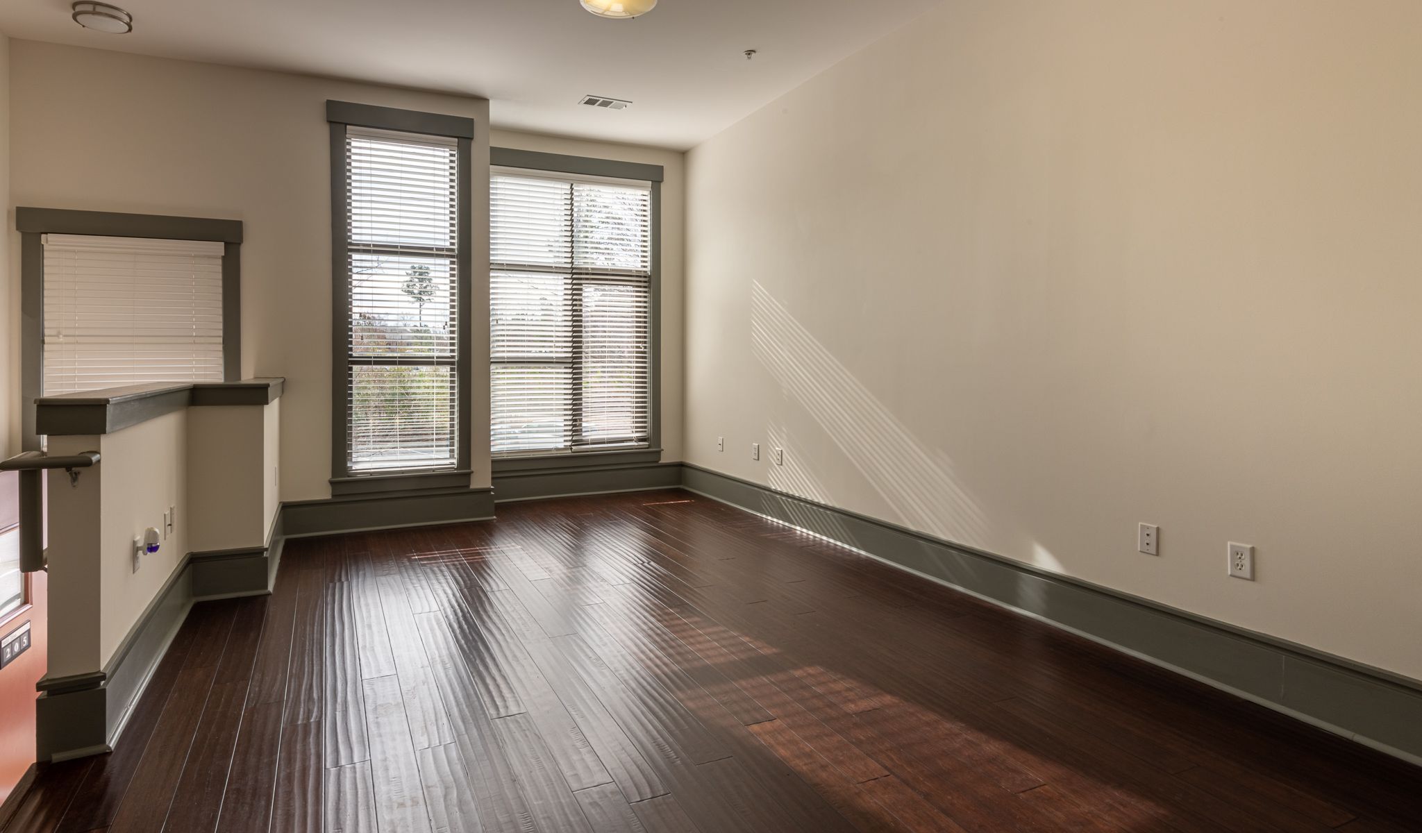 Chapel Hill North apartments luxury Vynal plank flooring in living area with large windows