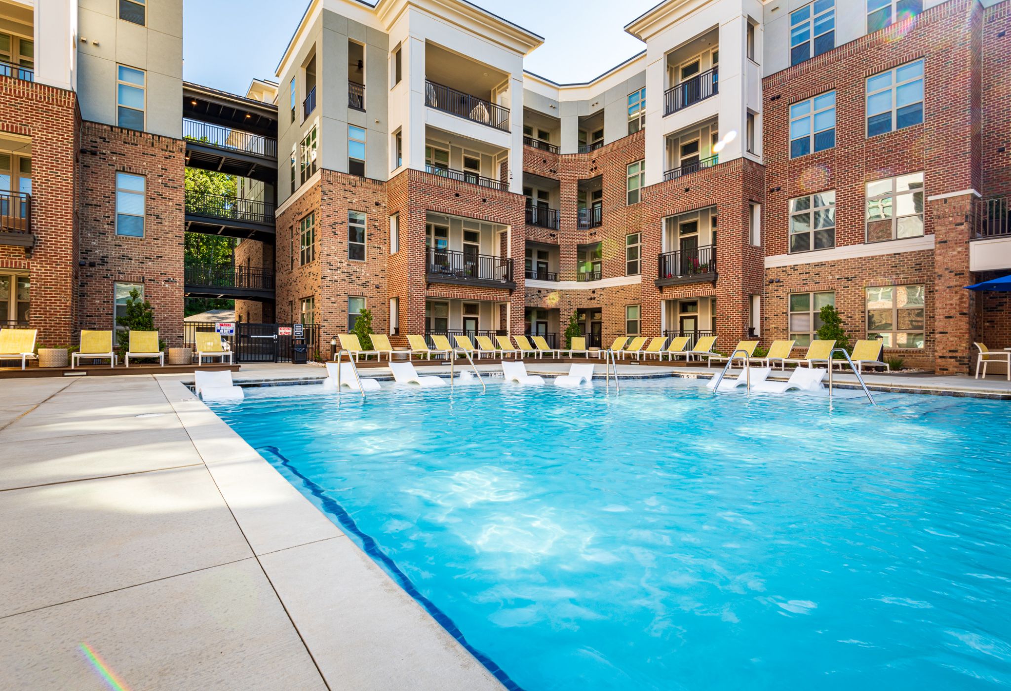 Apartments at Caraway Village view of the pool with apartments in the background